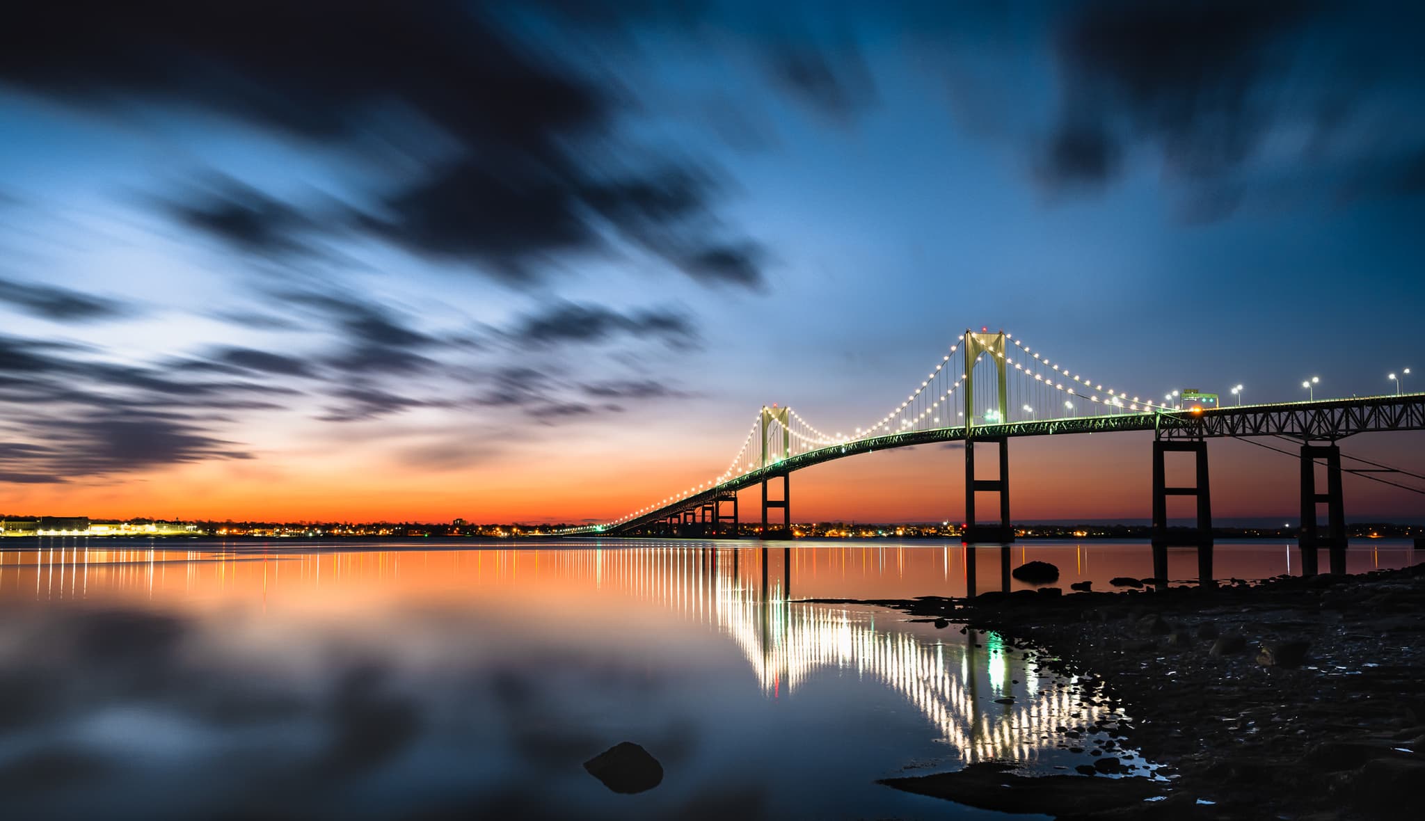 Newport Pell Bridge lit up at blue hour from Taylor Point